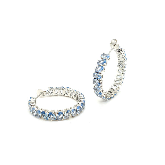 Sterling Jewellers' Ovale Acqua Large Hoop Earrings in Rhodium Plating with Aqua Blue Stones from the new Ovale Collection